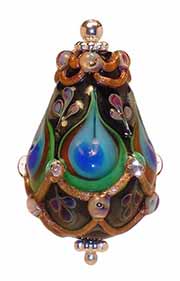 A lampworked bead inspired by a peacock feather